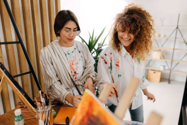 istock Female fine artists drawing in studio 1392333698