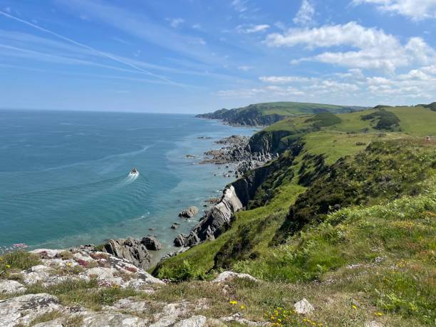 istock Dramatic North Devon Coastline near Morthoe with the Ilfracombe Princess conducting a boat trip 1392333729
