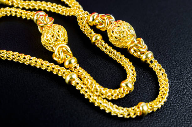 istock The Gold necklace on black leather. 1392337391