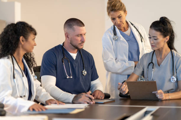 istock Medical Students Discussing Patient Cases 1392339713