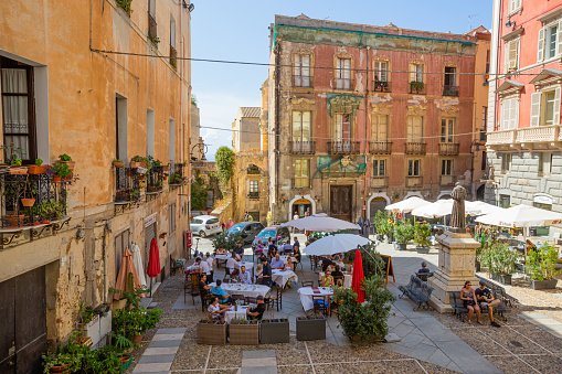 Cagliari,Sardinia,Italy 09 September 2021:Carlo Alberto square in the historic center  also occupied by some  restaurant.