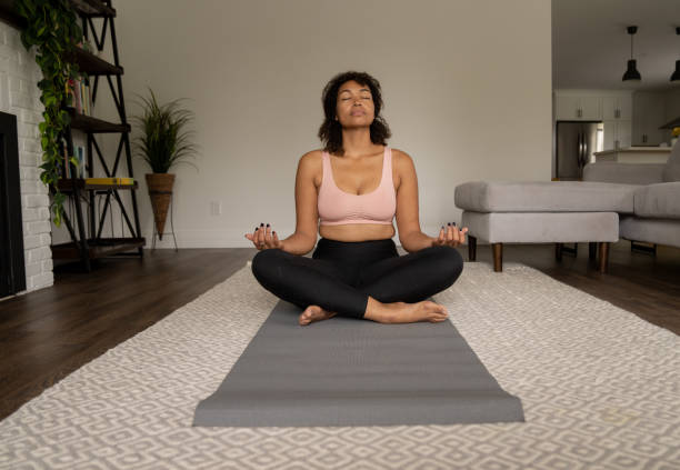 istock Woman Meditating at Home 1392345441