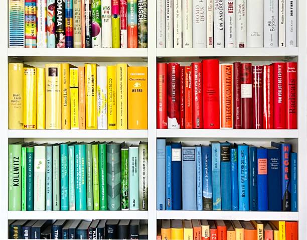 istock Library: Book rows in separated yellow, red, green and blue spines 1392346606
