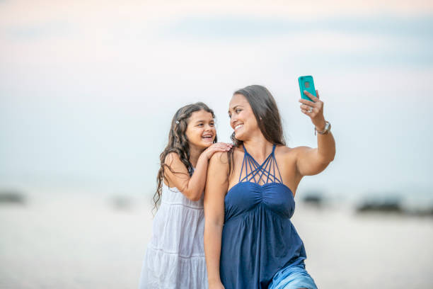 istock Mother and Daughter Vacation Selfie 1392347193