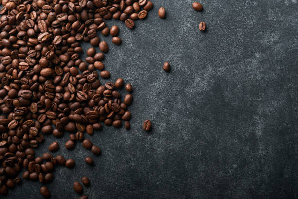 istock Coffee beans background. Roasted coffee beans. View from above. Coffee concept. Mock up. 1392349490
