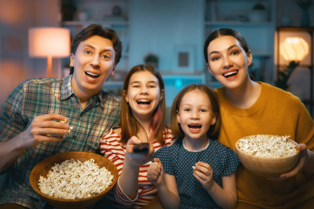 istock Mother, father and daughters spending time together. 1392352636