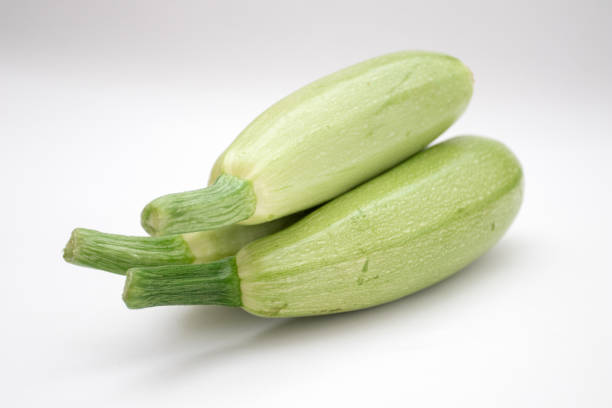 istock Fresh whole zucchini on white background 1392353502
