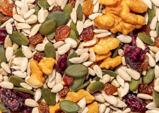 istock Nuts and seeds as a  background. Pattern  of granola or muesli Top view 1392353772
