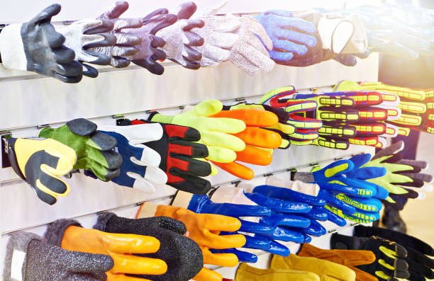 gloves for workers and builders in store - textile textile industry warehouse store imagens e fotografias de stock