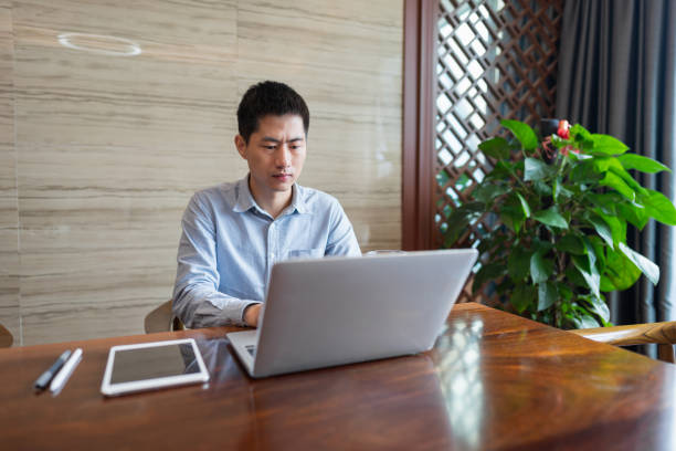 istock Asian man working with laptop in office 1392355516