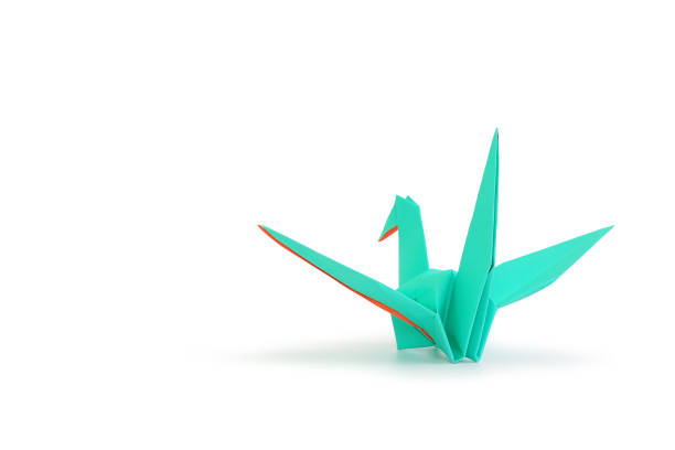 istock Origami bird isolated on white studio background. Image with Clipping path and copy space 1392359028