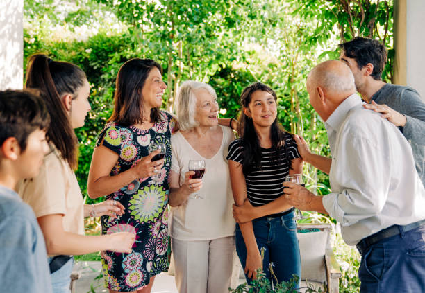 istock Happy multi-generational family with drinks at patio 1392359240