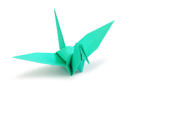 istock Origami bird isolated on white studio background. Image with Clipping path and copy space 1392359282