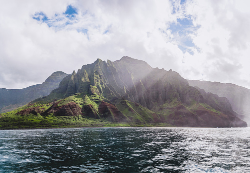 Napali Coast in Kauai, Hawaii from a boat. With beautiful blue sky