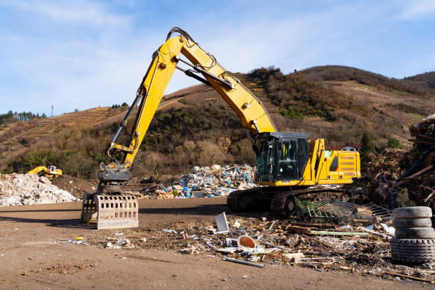 istock Excavator on a landfill in the vineyards 1392361484