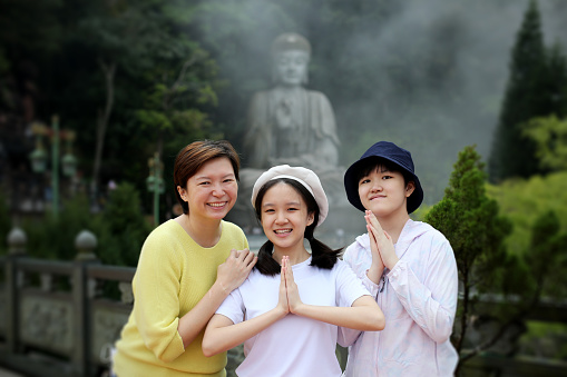 An Asian teenage girls are enjoying travelling with their mother at Chin Swee Temple, Genting Highland Malaysia.