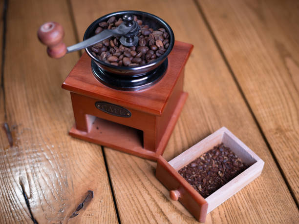 istock Old vintage grinder with roasted coffee beans and grind coffee 1392364203