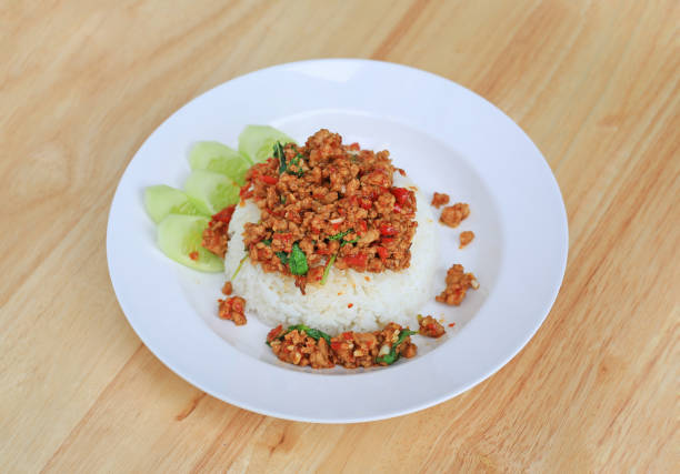 Rice topped with Minced pork and basil leaf. Thai food.