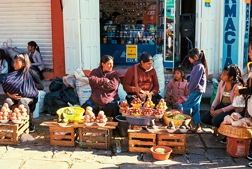 San Cristobal de las Casas, Chiapas, Mexico February 11, 2022: Mayan women selling fruits on market in San Cristobal