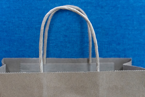 paper bag in front of blue background