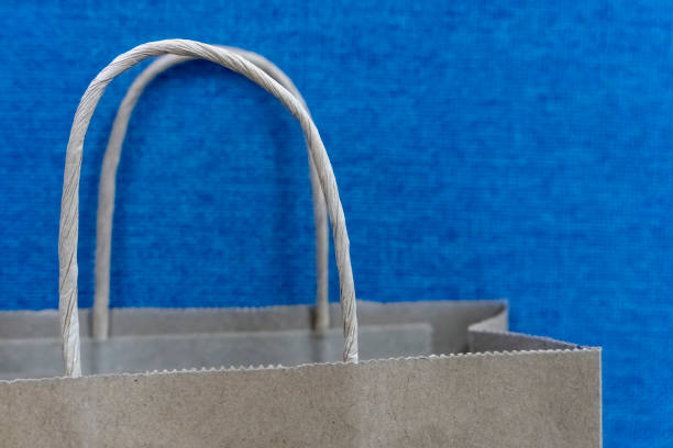 paper bag in front of blue background