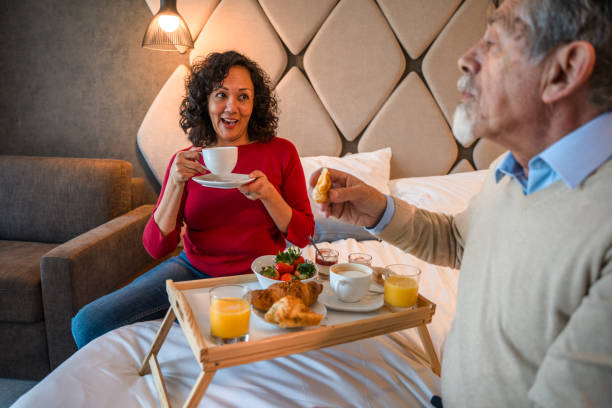 istock Senior Couple Having   Breakfast in a Hotel Room 1392370363