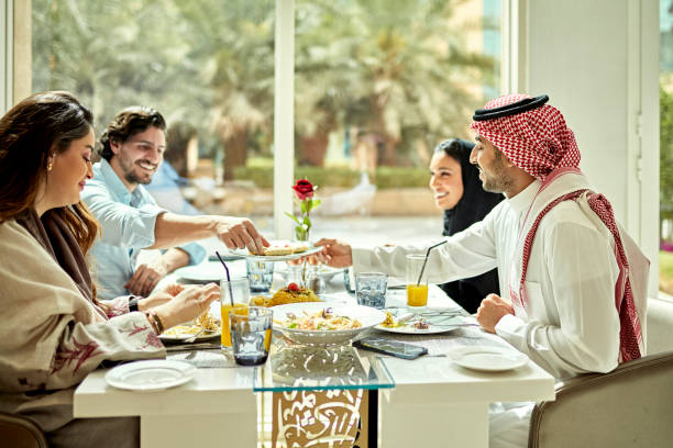 istock Young Saudi business professionals dining together 1392375181