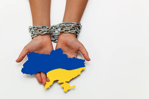 istock hands tied with a chain on a white background 1392375986