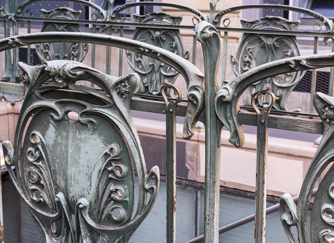 Forged fence at the entrance to the metro station Palais Royal - Louvre, Paris, France