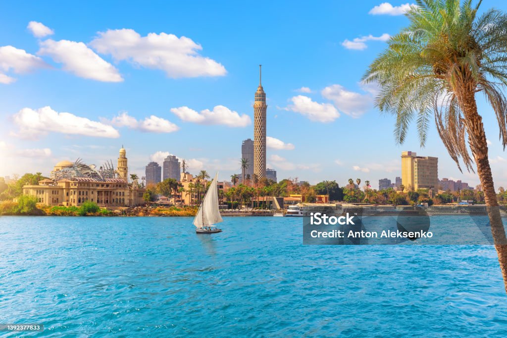 Cairo downtown, view on Gezira Island in the Nile and sailboat, Egypt, Africa Cairo downtown, view on Gezira Island in the Nile and sailboat, Egypt, Africa. Nile River Stock Photo