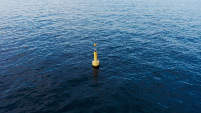 Yellow Marine Buoy in the ocean