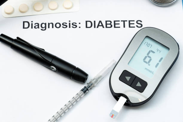 istock words diabetes, diagnosis with syringe, pills and stethoscope. 1392381910