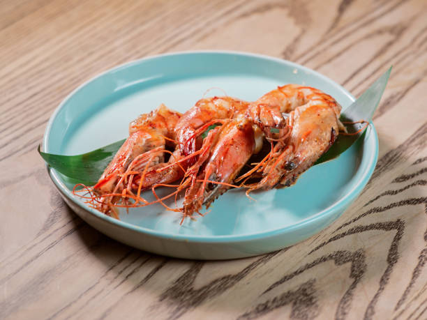 istock shrimp on the plate on the table in the bar 1392386054