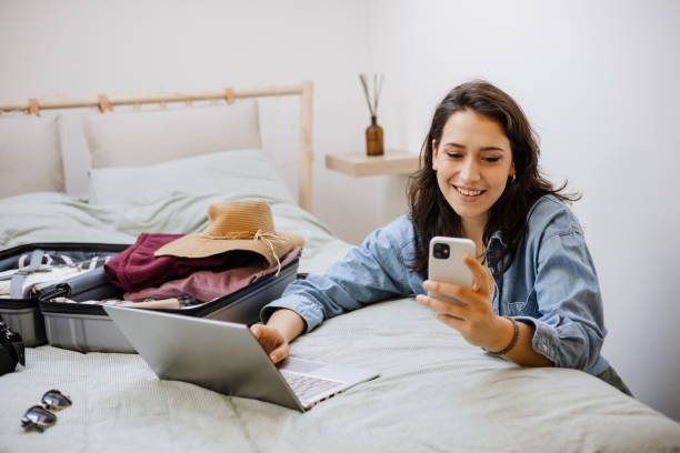 istock Young woman booking her next trip 1392386091