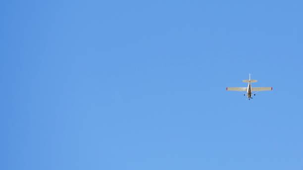 istock Small recreational plane, ideal for flight practice flying over a blue sky on a clear day 1392388972