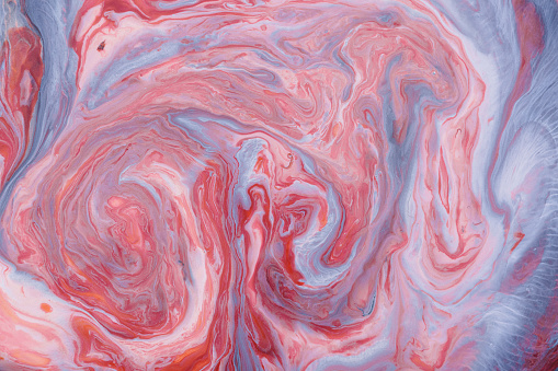 Closeup abstract color mixing of acrylic for use as background. Acrylic texture with marble pattern, pink marbling background