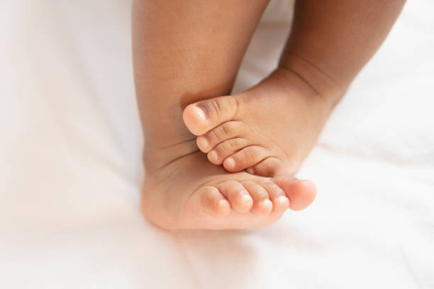 baby feet close up stock photo