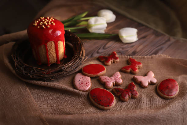 Homemade Traditional Easter cake with red icing. Postcard with Easter bread and chicken eggs. Easter background. High quality photo. High quality photo