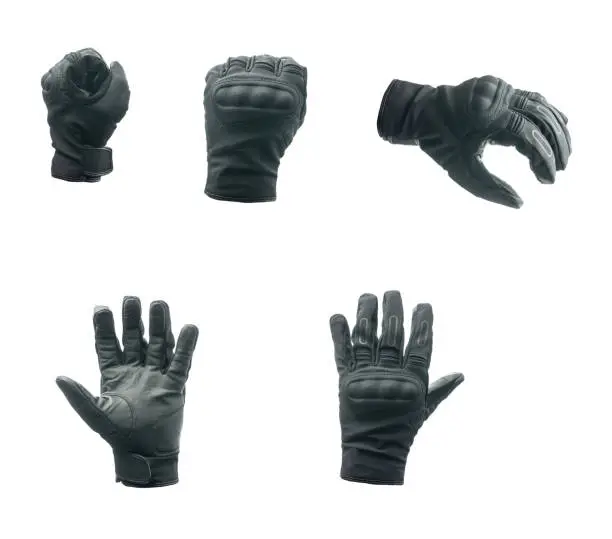 Photo of Black motorcycle gloves isolated on white background.