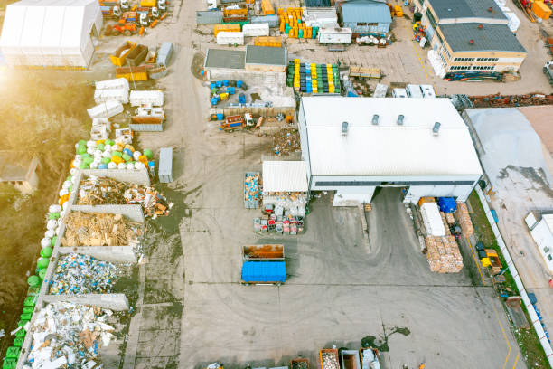 istock Top view of a landfill with various waste. Many dumpsters and garbage trucks sorting and recycling garbage in the industrial areas of the city 1392398056