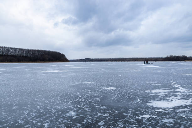 istock Frozen river, river covered with ice in frost, winter landscape 1392398624