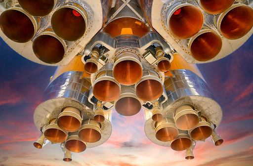 Details of space rocket engines against the sky background