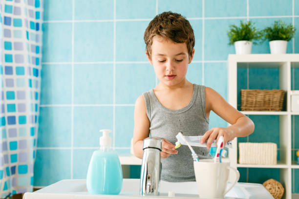 istock Boy and daily hygiene brushing teeth 1392401508