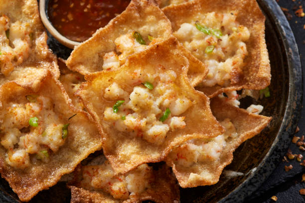 Crispy Shrimp Wontons Crispy Shrimp Wontons with a Sweet Chili Sauce chinese food photos stock pictures, royalty-free photos & images