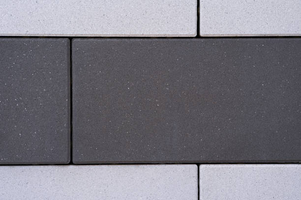 istock Background with dark stone blocks in the middle and light stone blocks at the top and bottom. 1392404806