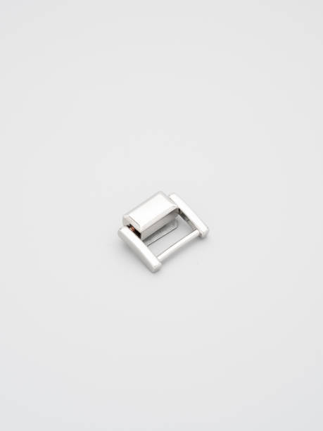 istock Metal adjusters and frames for making bags and backpacks on a grey background. Chrome-plated metal frames for handbags straps. Sewing accessories, bags making 1392405319