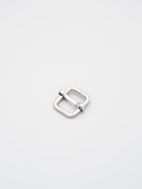 istock Metal adjusters and frames for making bags and backpacks on a grey background. Chrome-plated metal frames for handbags straps. Sewing accessories, bags making 1392405361