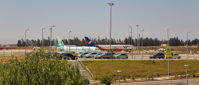 Larnaca, Cyprus - May 31, 2021: Cyprus Airways and Azur Air airplanes in Glafcos Clerides Larnaca international airport. Larnaca is the third-largest city in the country, after Nicosia and Limassol.