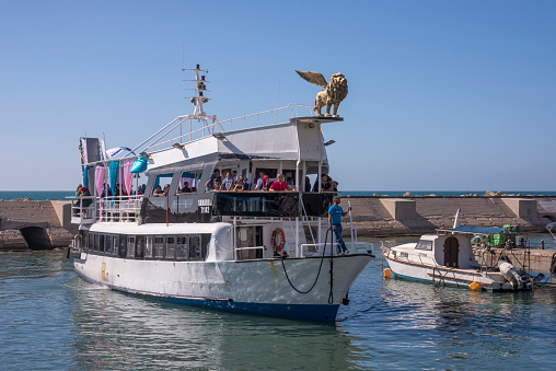 Tel-Aviv, Israel - April 30, 2015: Passenger ship entering the historic port of Yafo