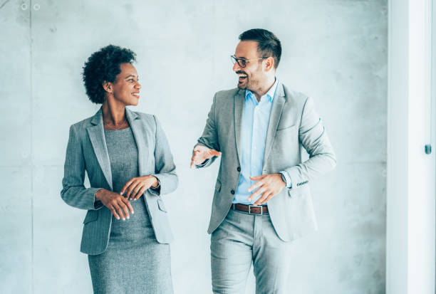 istock Two cheerful business people 1392408117